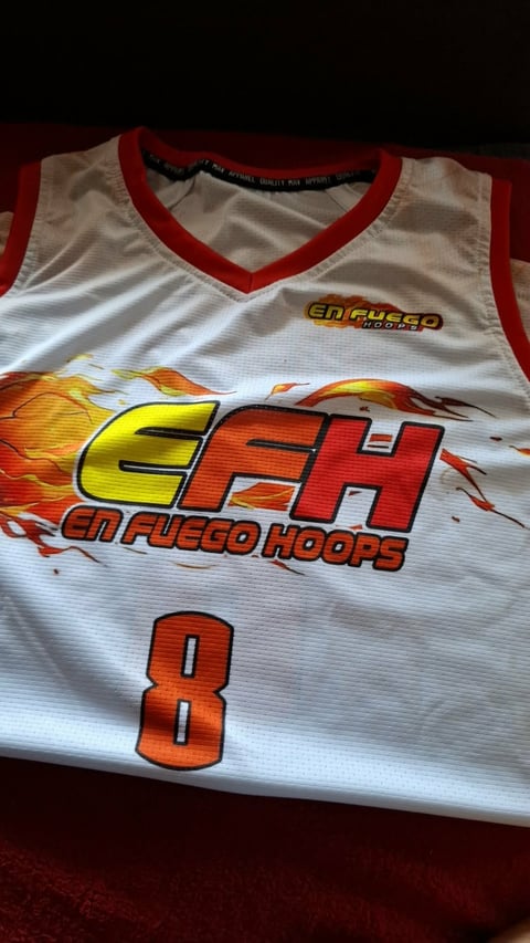 White and red basketball tank top jersey with CFH Enfiuego Hoops logo and number 8